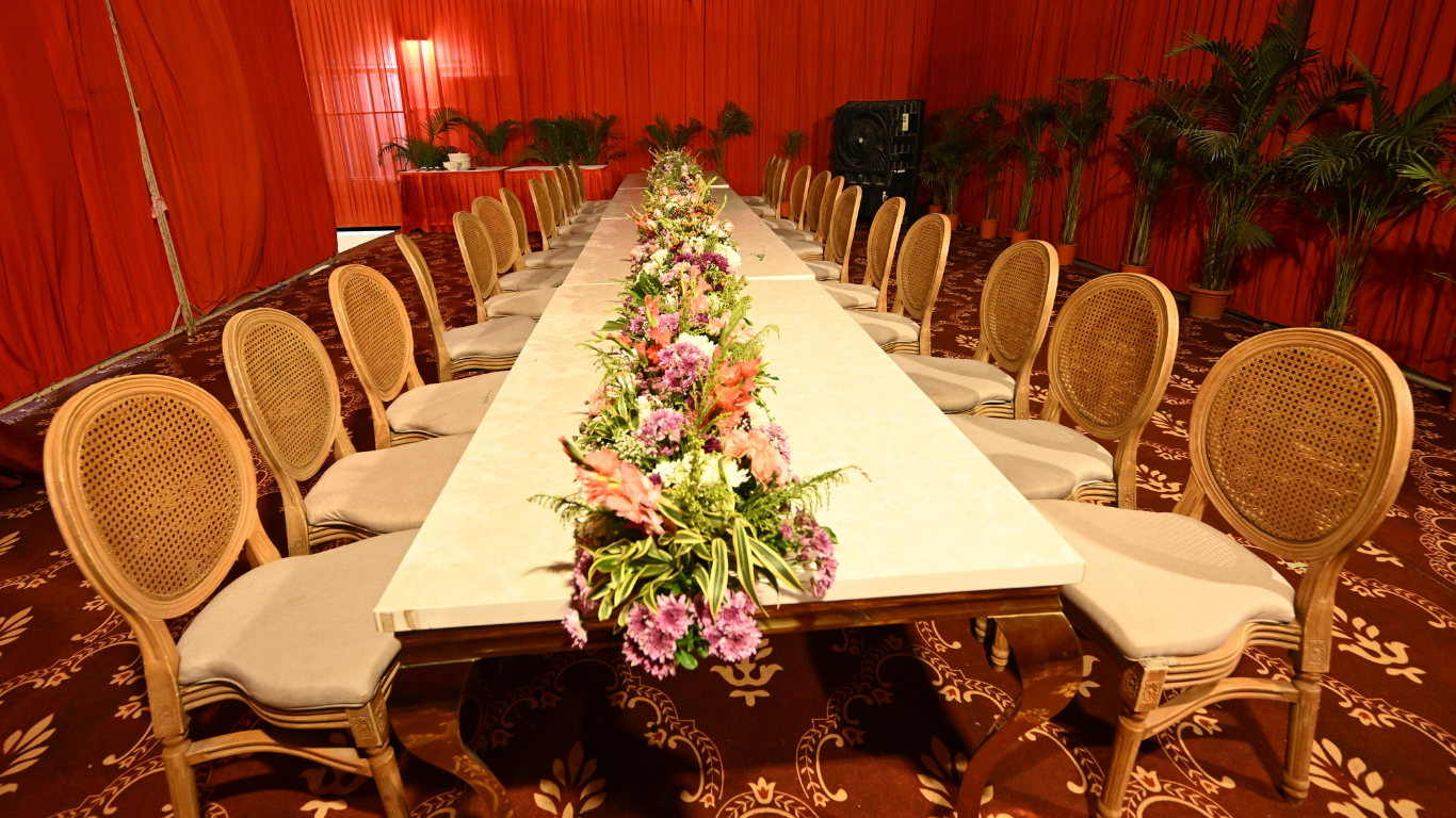 Elegant wedding dining setup with floral centerpiece