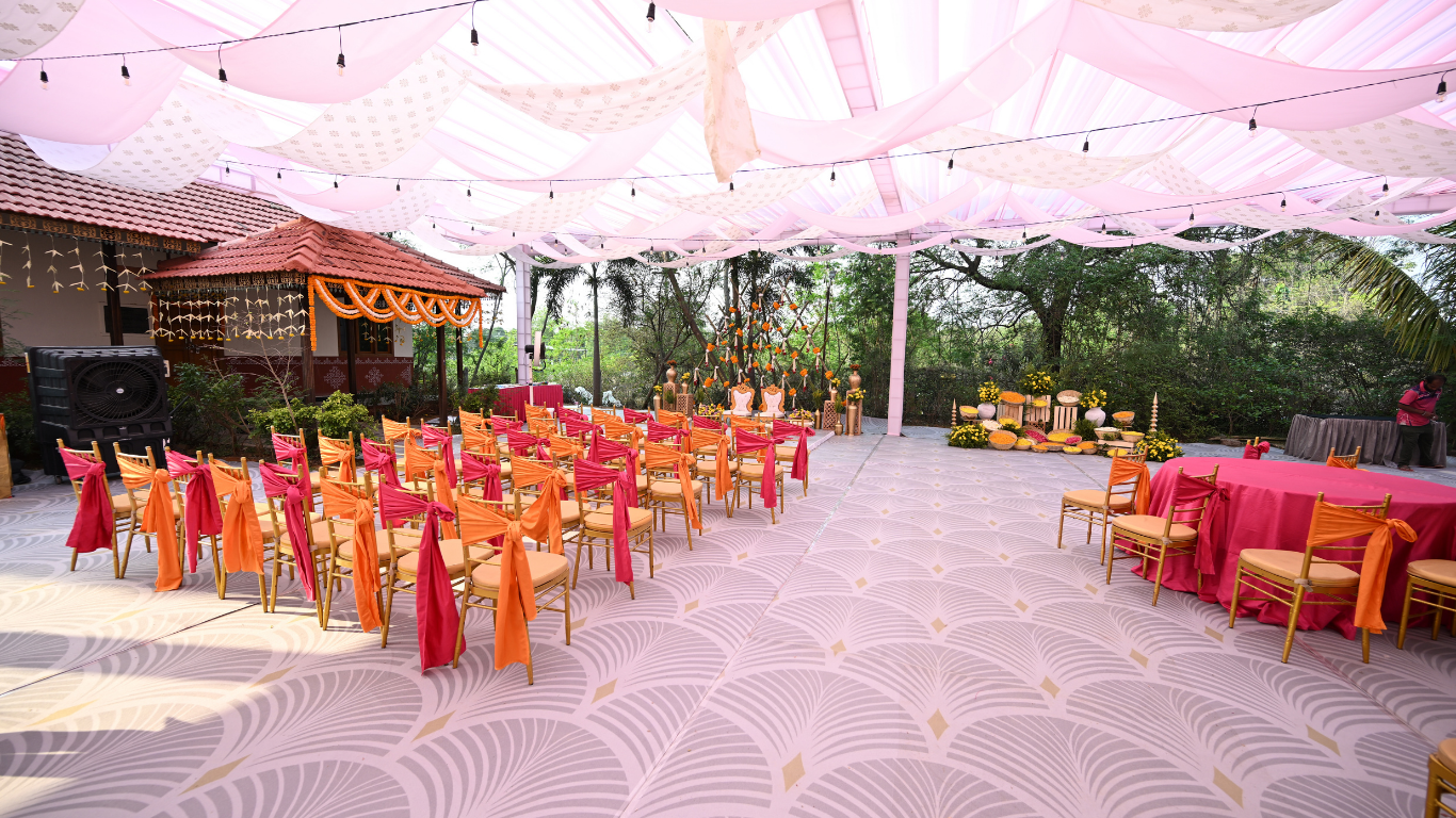 Haldi ceremony area with pastel draped canopy and seating setup
