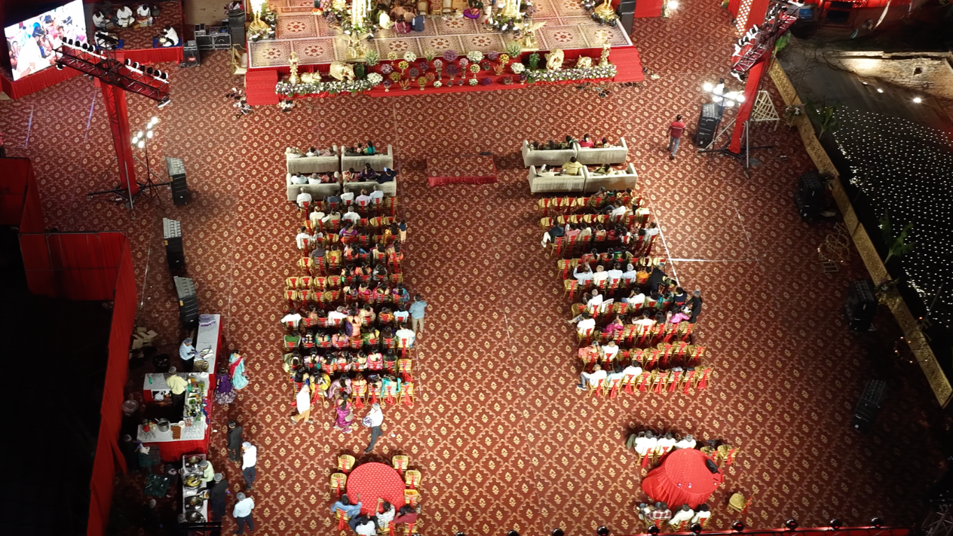 Aerial view of the guest seating area facing the wedding stage