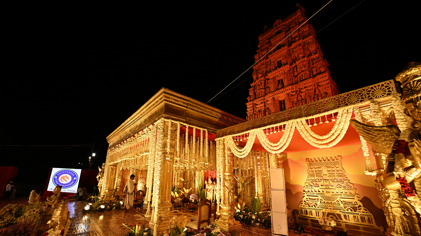 Ammapalli Temple gopuram with illuminated wedding mandap at night