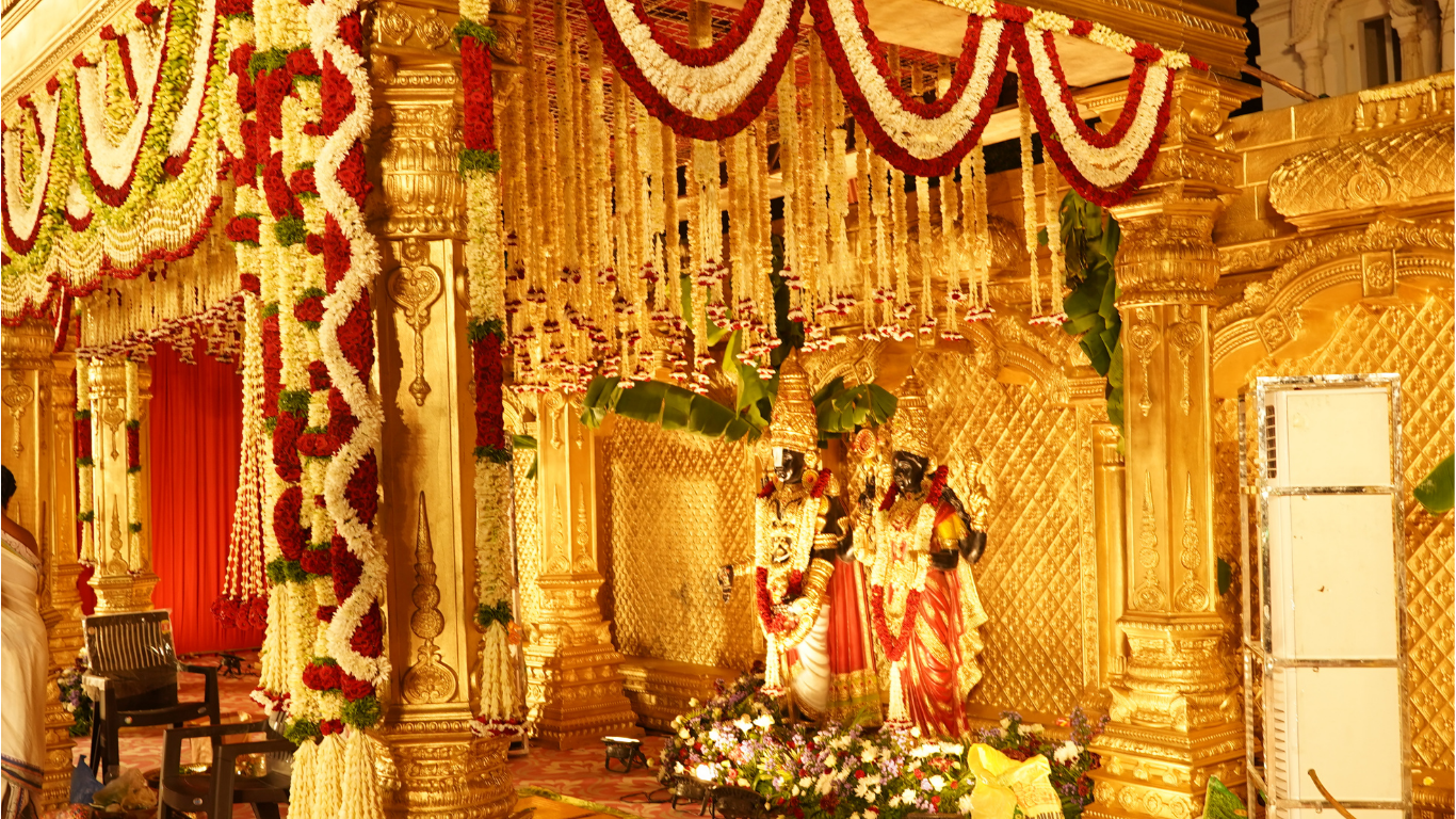 Golden temple wedding decor with deity backdrop