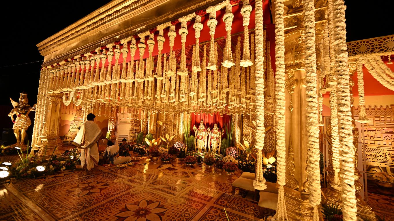 Night-time mandap decor with hanging jasmine garlands