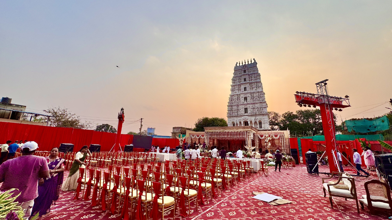 Temple wedding ceremony with full guest seating at sunset